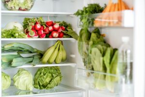 Refrigerator full of fresh vegetables and fruits